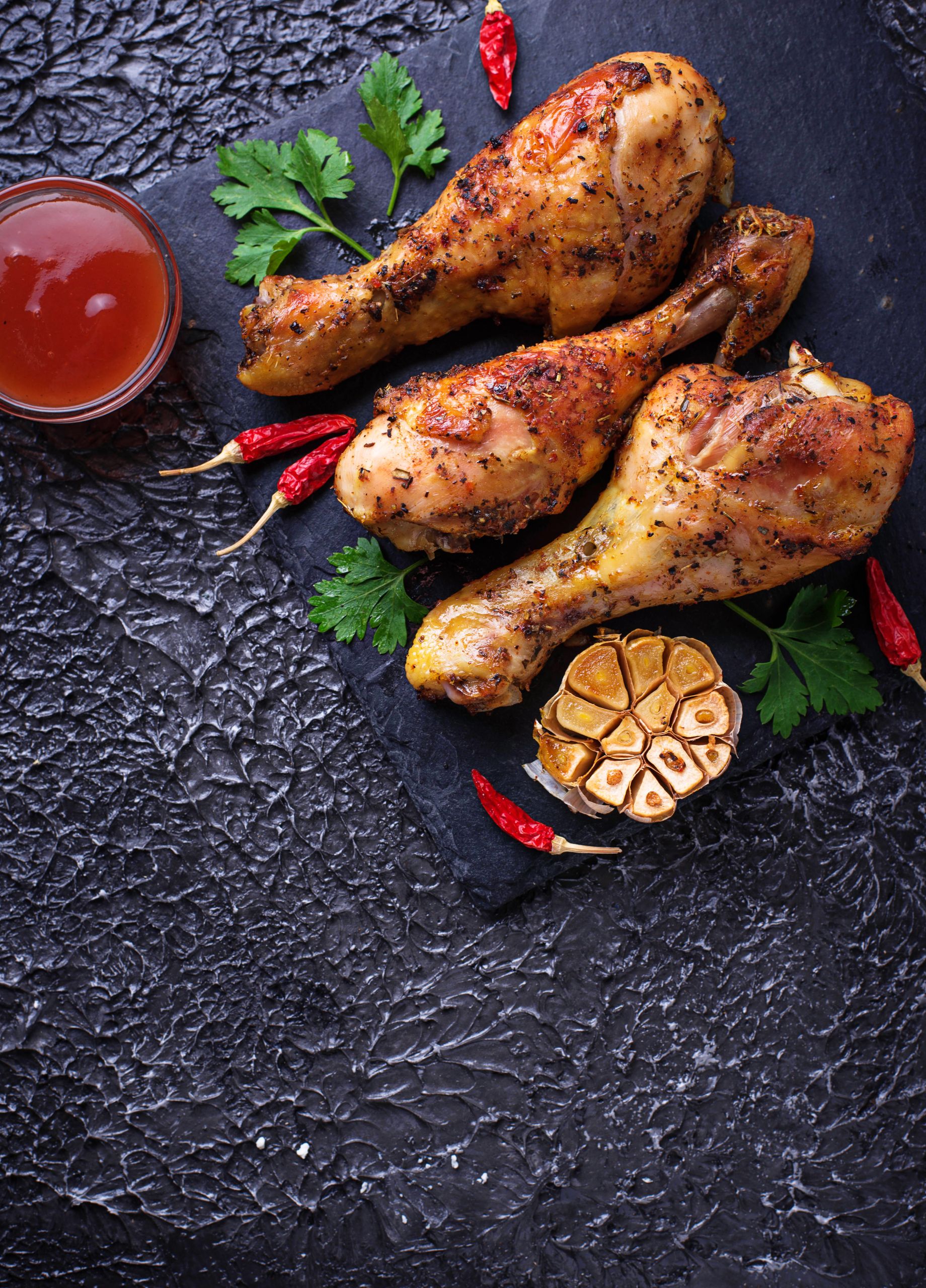 Grilled chicken legs with spices and garlic.